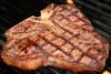 A delicious steak cooked on a charcoal grill