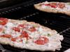 Pizza grilling on grill. tomato basil pizza recipe