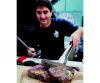 GRILL MASTER: Reza Mofakham works the grill during a weekly customer appreciation barbecue at Kerrisdale Lumber in Vancouver.