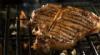 T-bone steak on barbecue grill